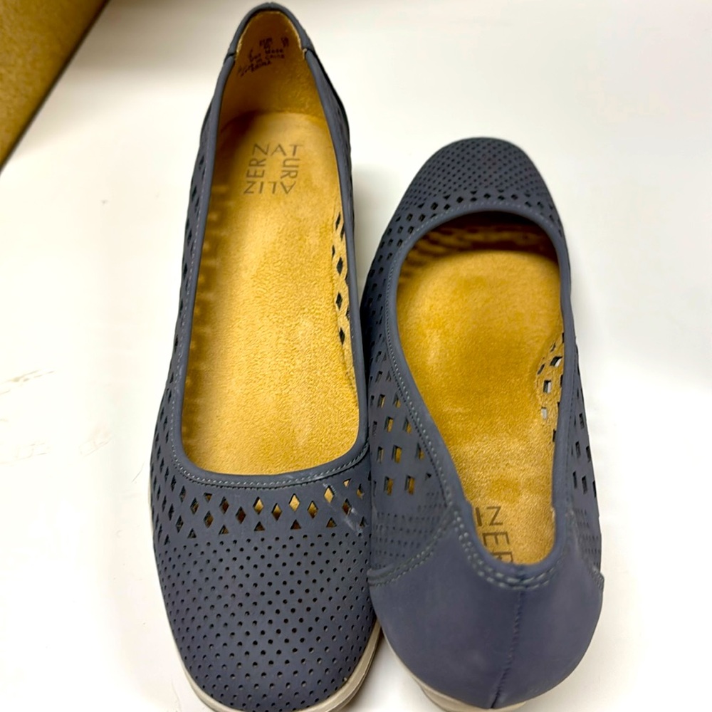 Naturalized slip on closed toe shoe. 1 1/2 inch heel. Non slip sole